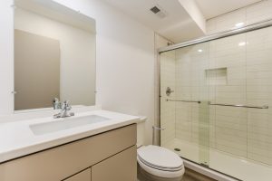 Bathroom with white subway tiled shower